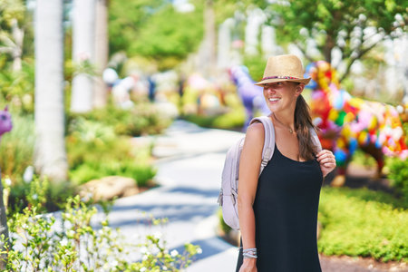 Picture from Miami of woman taking selfie in parkの写真素材