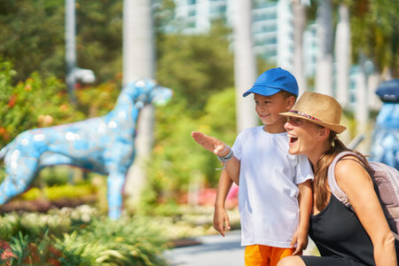 Picture from Miami of mother with son in the park with art animalsの写真素材