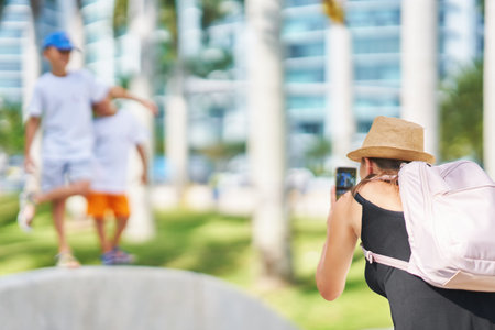 Picture from Miami of mother taking picture of sons
