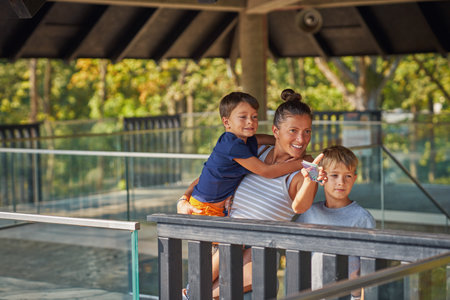 Photo of mother with kids in the zooの写真素材
