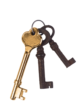 A golden key and two rusted ones.の写真素材
