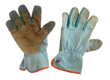 Pair of used gardening gloves isolated on white background