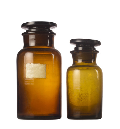 Two old medical brown glass jars isolated on white backgroundの写真素材