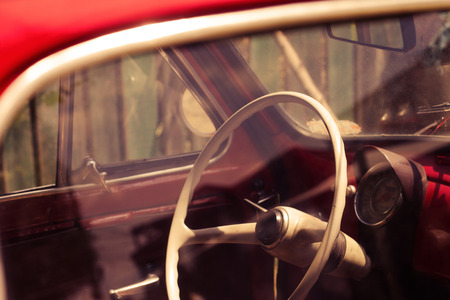 horizontal close up of the interior of a red vintage carの写真素材