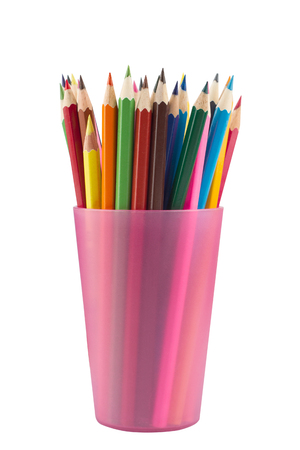 Many drawing pencils in a pink transparent cup isolated on whiteの写真素材
