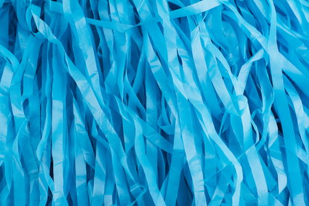 horizontal pattern close up with many blue plastic stripsの写真素材