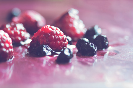 Horizontal macro close up of strawberry and blueberry cake jello with shallow depth of field の写真素材