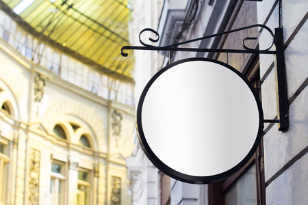 Horizontal front view of empty round signage on a building with classical architectureの写真素材