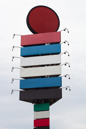 front view of industrial park branding totem with empty colored signage billboardsの写真素材