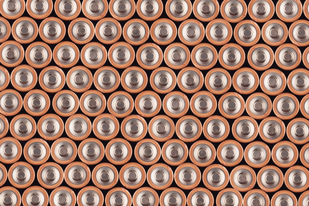 top view background texture of electric batteries and accumulators AAA AA packed close to each otherの写真素材