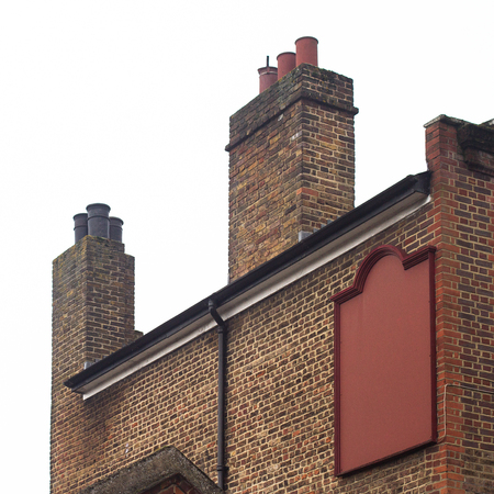 Horizontal side view of empty square signage on a brick decorated building with classical architectureの写真素材