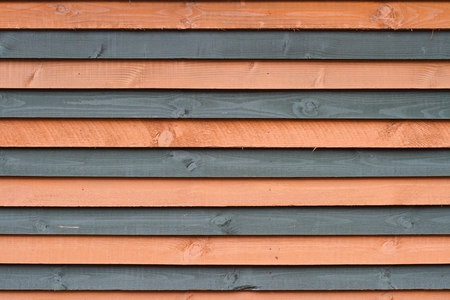 front view of different color wooden planks wall background textureの写真素材