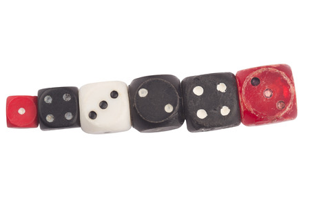 top view detail closeup of pile of many different color and sizes vintage used rolling dices...
