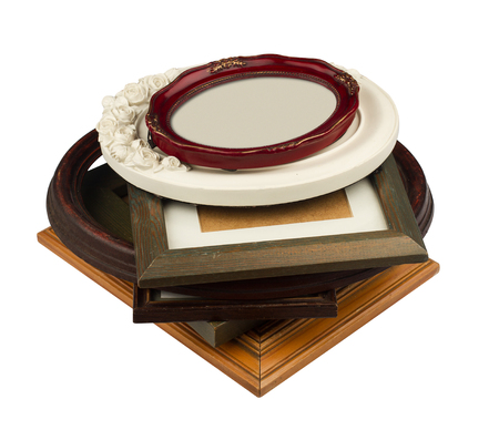 perspective view of stack wood vintage frames of all shapes colors and seizes isolated on white backgroundの写真素材