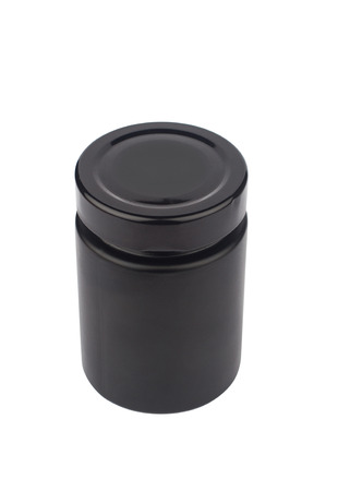 high angle view closeup of black glass closed jar with no label and dark shiny cap isolated on white backgroundの写真素材