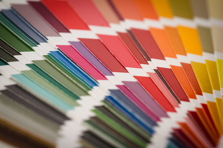 front view close up of multicolor color pantone  paper spectrum sampler texture background patternの写真素材