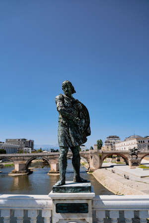SKOPJE, NORTH MACEDONIA - AUGUST 19, 2021: Bronze statue of historical figures on Vardar river bridge in Skopjeのeditorial素材
