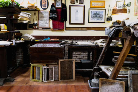 OHRID, NORTH MACEDONIA - AUGUST 27, 2021: Sheets of handcrafted paper and tools arranged on shelves in National Workshop For Handmade Paper Ljupcho Panevskiのeditorial素材