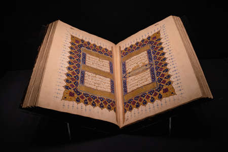 ISTANBUL, TURKEY - AUGUST 8, 2021: Close up of open Quran on display in the museum collection of...