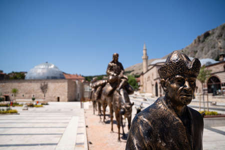 TOKAT, TURKEY - AUGUST 6, 2021: Group of bronze statues depicting a caravan with men and camels in front of the Tokat historical museumのeditorial素材