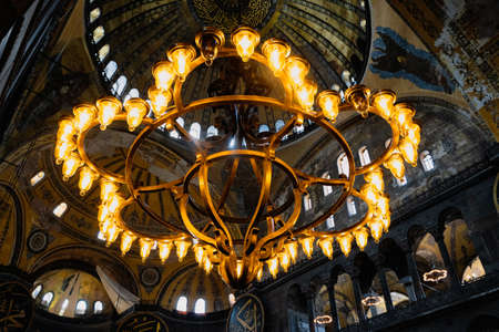 ISTANBUL, TURKEY - AUGUST 9, 2021: Close up of chandeliers in the interior of the Hagia Sophia...