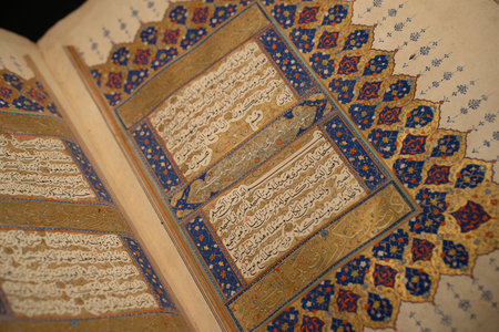 ISTANBUL, TURKEY - AUGUST 8, 2021: Close up of open Quran on display in the museum collection of Topkapi Palaceのeditorial素材