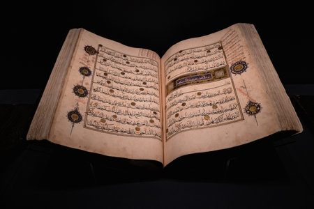 ISTANBUL, TURKEY - AUGUST 8, 2021: Close up of open Quran on display in the museum collection of Topkapi Palaceのeditorial素材