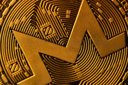 top view extreme macro closeup of crypto Monero golden coin logo symbolの写真素材