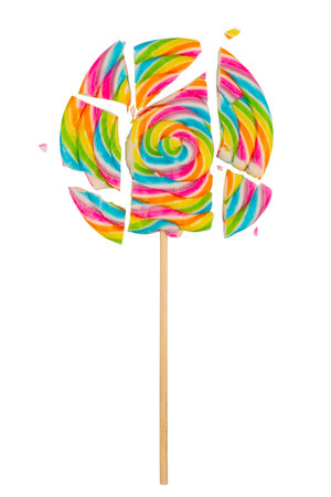 closeup detail of colorful lollipop candy on a stick broken into pieces and isolated on white backgroundの写真素材