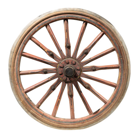 An antique wooden wagon wheel with metal rims displayed against a white backgroundの写真素材