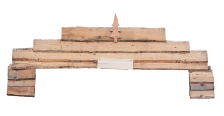 A rustic wooden structure featuring a small tree shaped decoration isolated on a white background for creative or decorative useの写真素材
