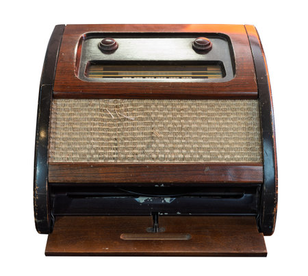 A front facing view of a vintage wooden radio with classic design elements isolated on a white backgroundの写真素材