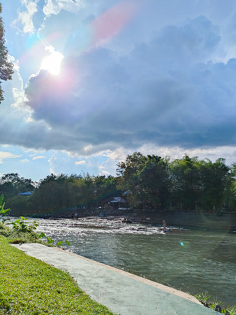 Afternoon Sunlight and Serenity by the Streamの写真素材