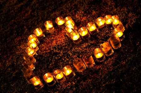 Heart made of Burning candles の写真素材