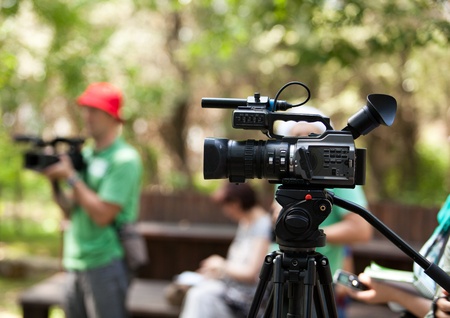 covering an event with a video cameraの写真素材