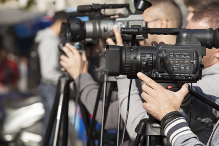covering an event with a video cameraの写真素材