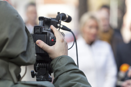 Covering an event with a video cameraの写真素材