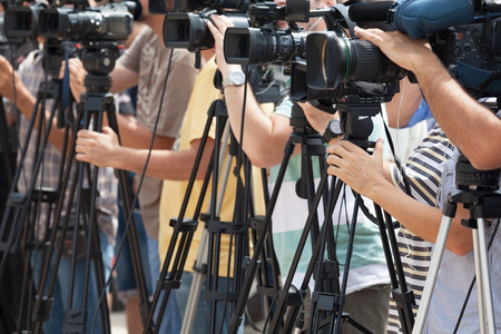 News conference. Filming an event with a video camera.