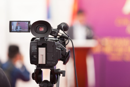 Filming an media event with a video cameraの写真素材