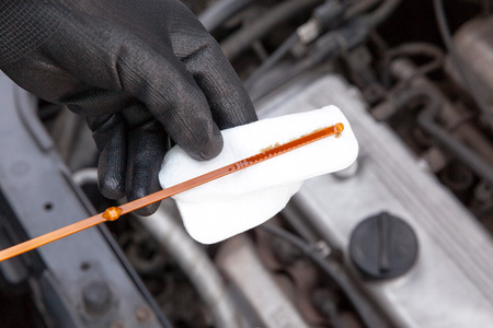 Checking oil level in the car engineの写真素材