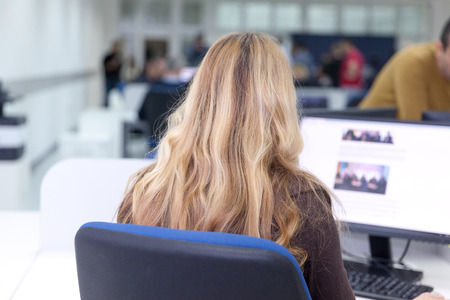 Female computer operator at workの写真素材