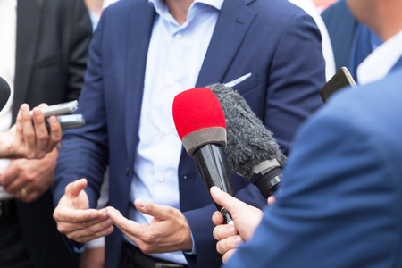 Media interview with businessman or politicianの写真素材