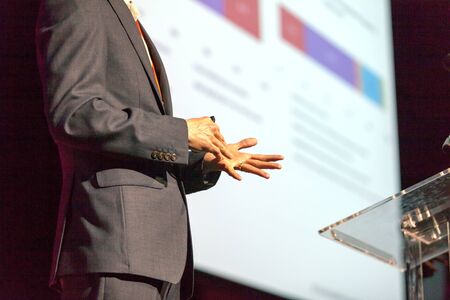 Speaker giving a talk on corporate business conference