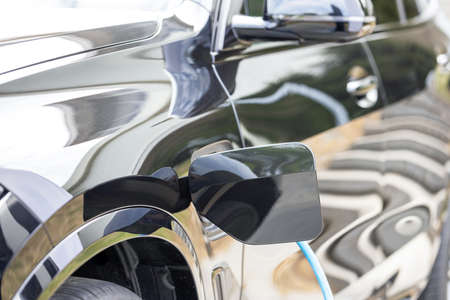 Charging connect power supply plugged into an electric car