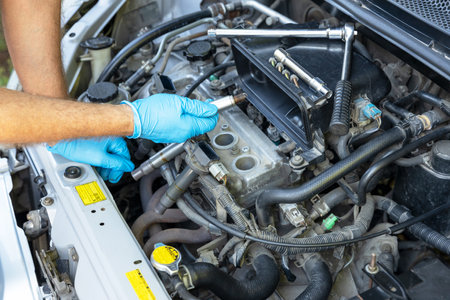 Car spark plug replacement. Repairing of vehicle.