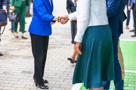 Female business persons or politicians welcome handshake before meetingの写真素材
