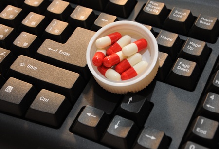keyboard vs medicinesの写真素材