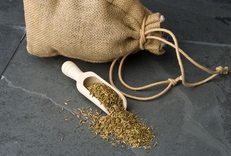 Cumin seeds with sack and scoop.の写真素材