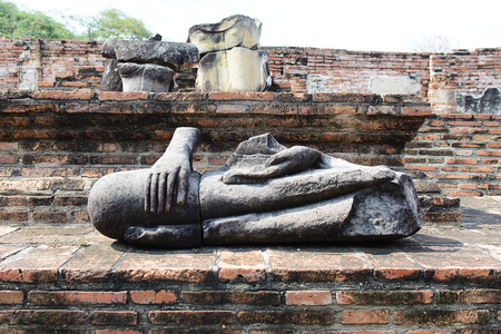 Broken Ancient buddha statue at Wat Mahathat temple complex in Ayutthaya.Thailandの写真素材