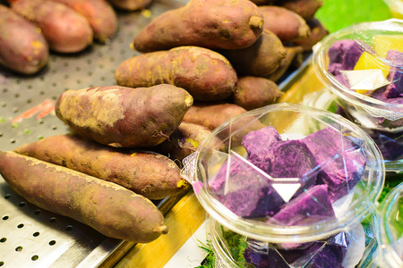 warm burned sweet potatoes street food in thailand,another root plant stream street food.の写真素材